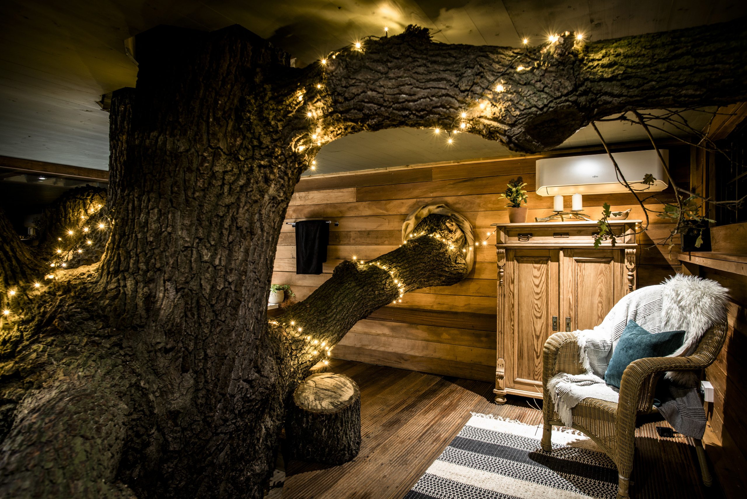 Nighttime photo inside The Old Oak at Colemans Farm showing the snug area