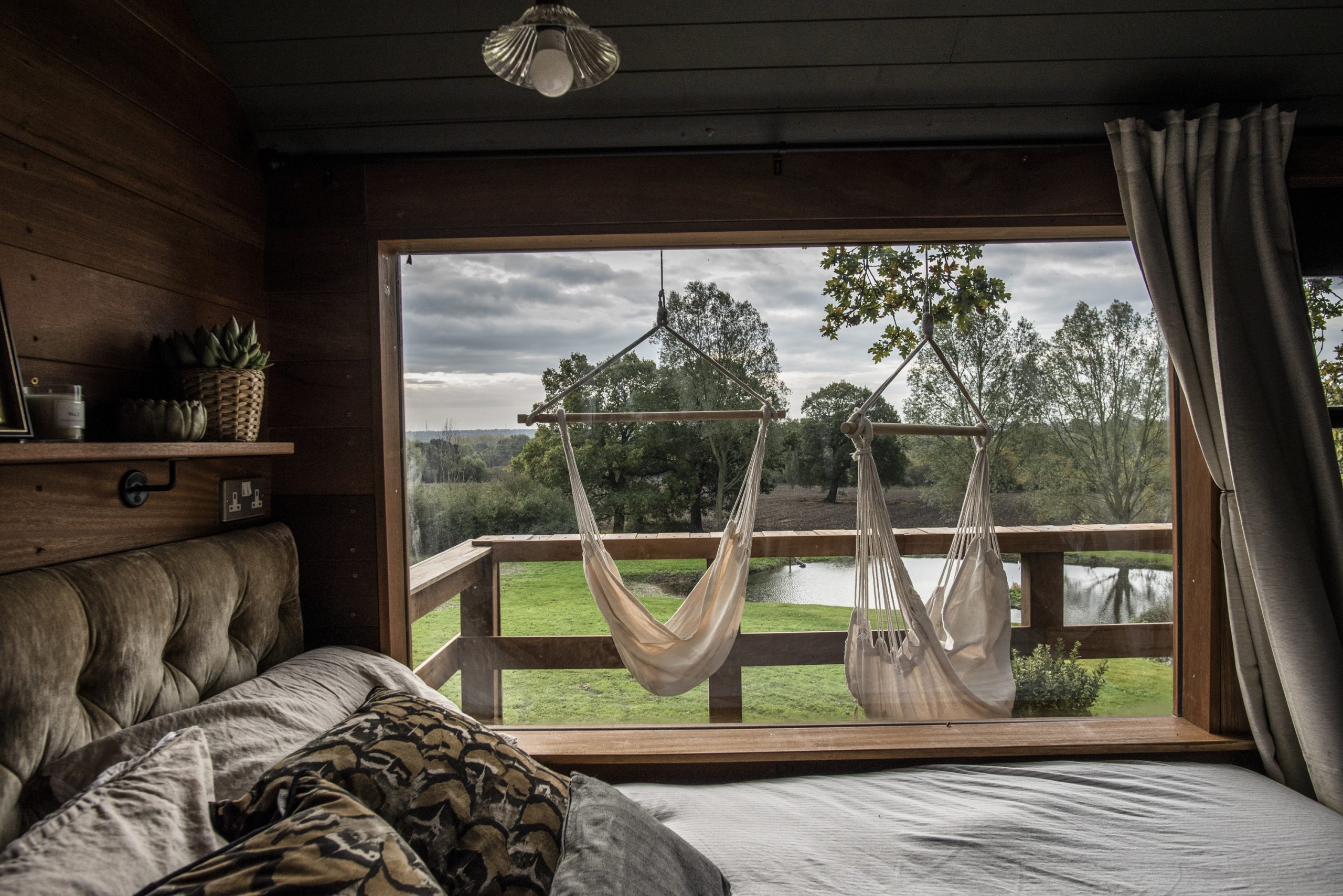 Looking out the large window from the sleeping area in The Old Oak at Colemans Farm